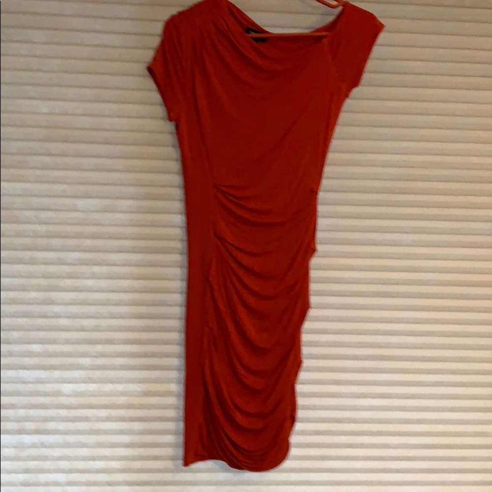 Ruched orange form fitted dress from Bebe